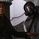 Y: The Last Man characters Agent 355 and a masked Yorick look stunned.